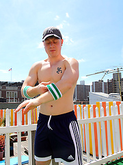 Saxon West posing naked on a roof