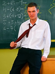 Steven Stefler posing naked in a classroom