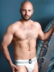 Bald hunk David Chase strokes his dick