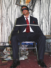 Marcello is tied up in a burnt out house by a masked man, who then apologises by licking his feet and sucking his big hard cock