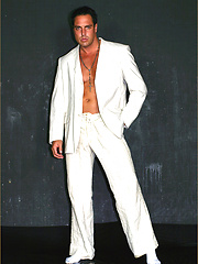 Marcello takes a shower clothed and shows off his gorgeous chest and cock